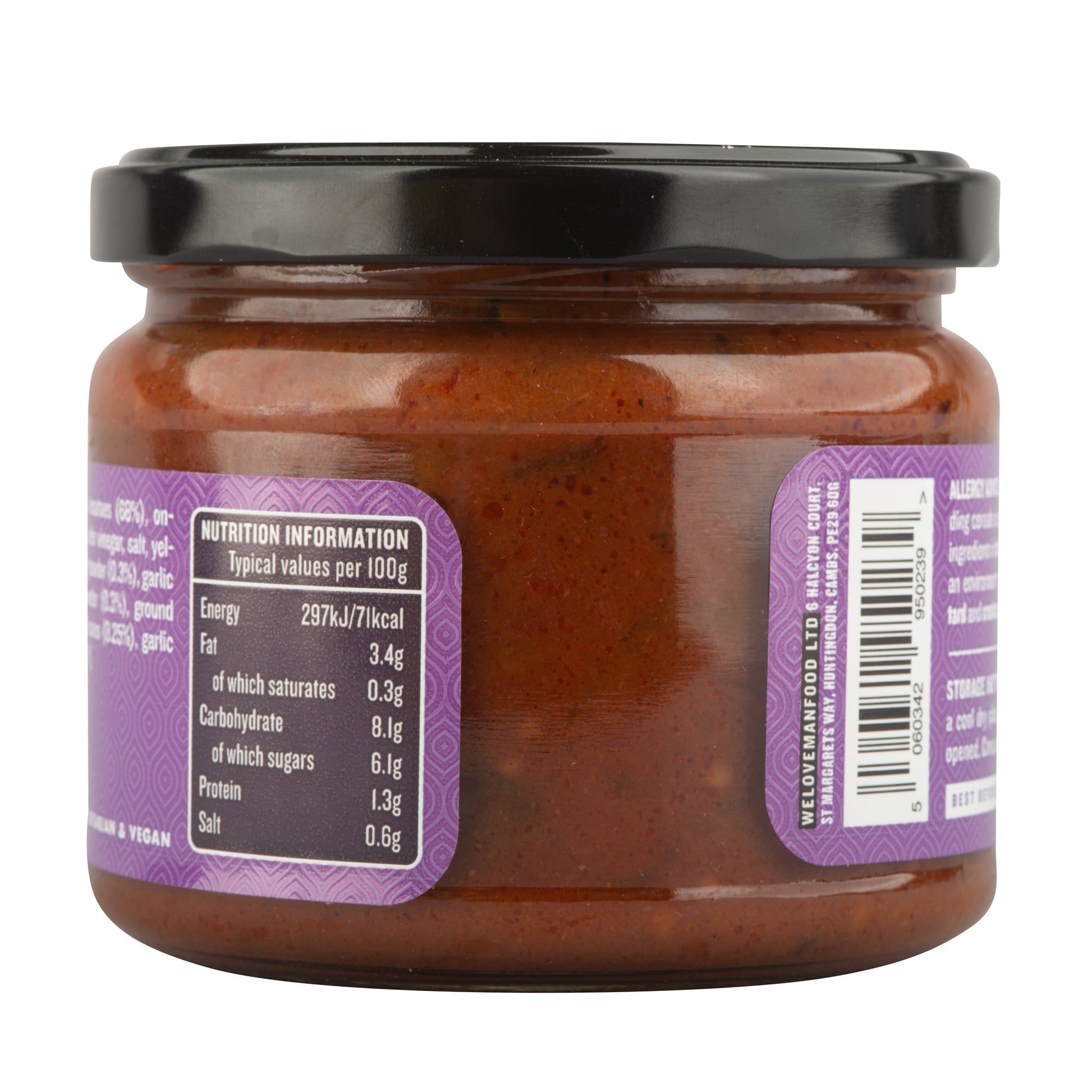 Spiced tomato chutney in a jar, showcasing vibrant red color and textured surface, made by Manfood.