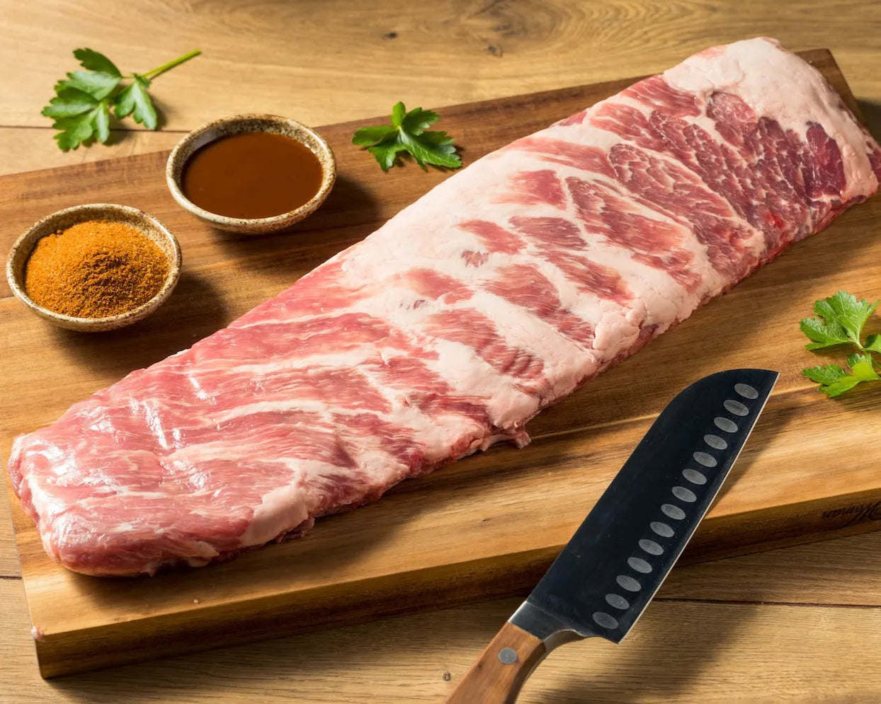 Raw St. Louis Style Pork Ribs from Primrose Herd, showcasing meaty, well-trimmed pork ribs ready for cooking.