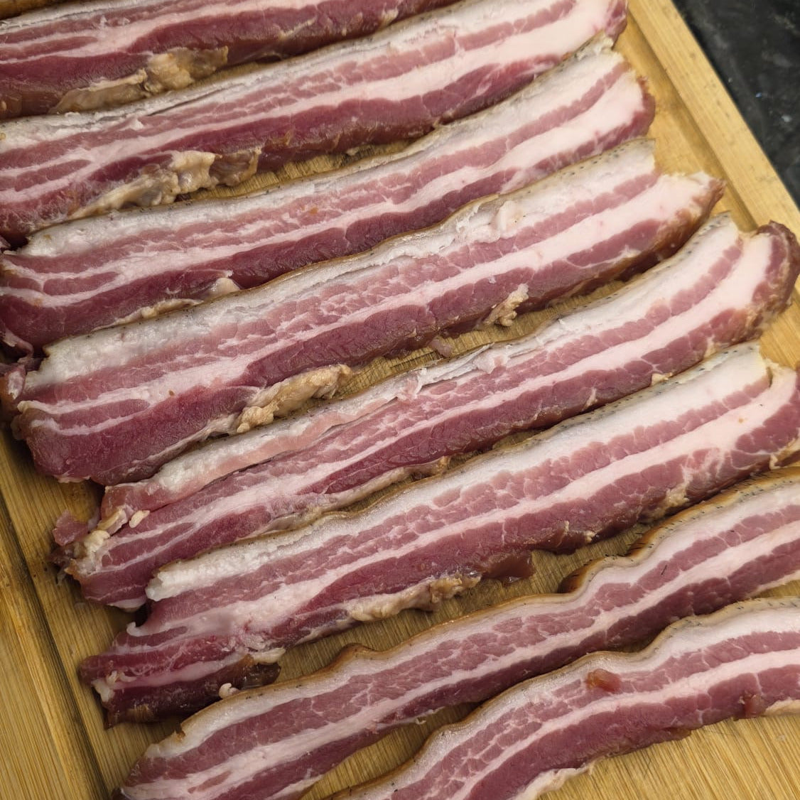 FireFly Barbecue sweet bacon curing kit with curing salts, spices, and instructions for homemade bacon preparation.
