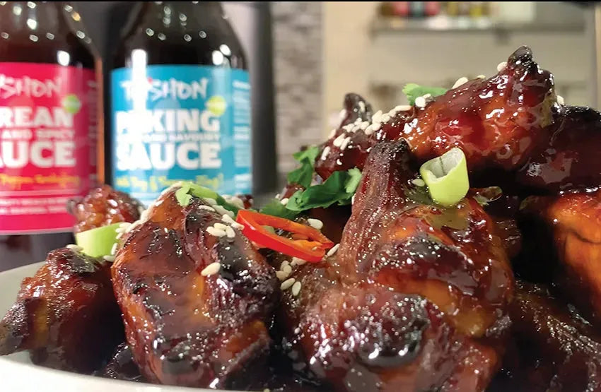 Taishon Peking Sweet and Savoury Vegan Sauce served over sticky ribs, showcasing a rich, glossy condiment for Asian-inspired dishes.