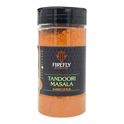 FireFly Barbecue Tandoori Spice Seasoning BBQ Rub in a jar with vibrant red and orange spices on a wooden surface.