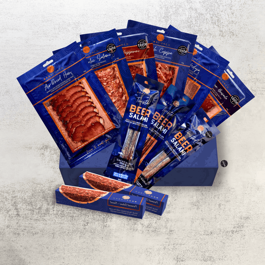 Assorted Bray Cured charcuterie selection featuring cured meats displayed on a wooden board.