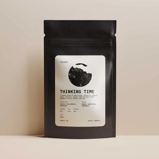 Nordfell Thinking Time Ethical Roasted Coffee Blend 250g, showing a bag of coffee with branding and rich roasted coffee beans.