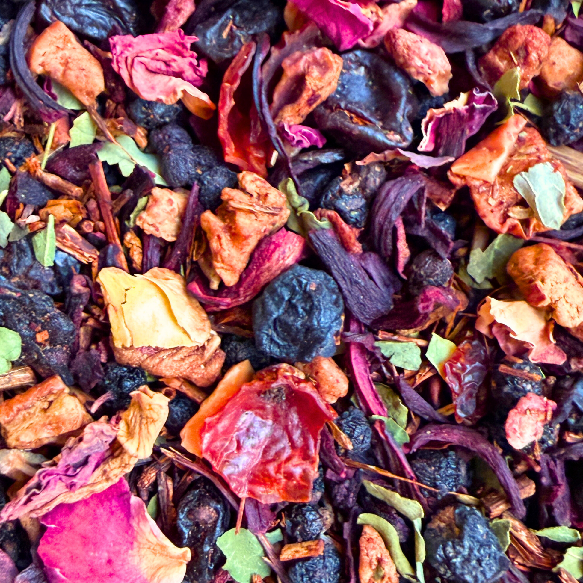 Porter Hill Tea Company Jingle Berry Rooibos Tea in a colorful box, showcasing vibrant berry illustrations and tea branding.