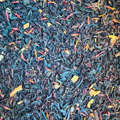 Black mulled wine flavored black tea by Porter Hill Tea Company featuring a steaming cup with spices and citrus slices.