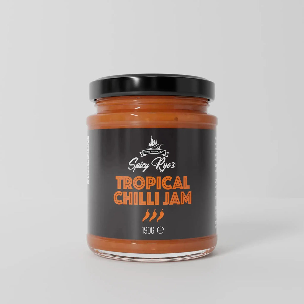 Spicy Ryes Tropical Chilli Jam jar with vibrant tropical fruit and chili ingredients visible inside, showcasing the colorful spread.