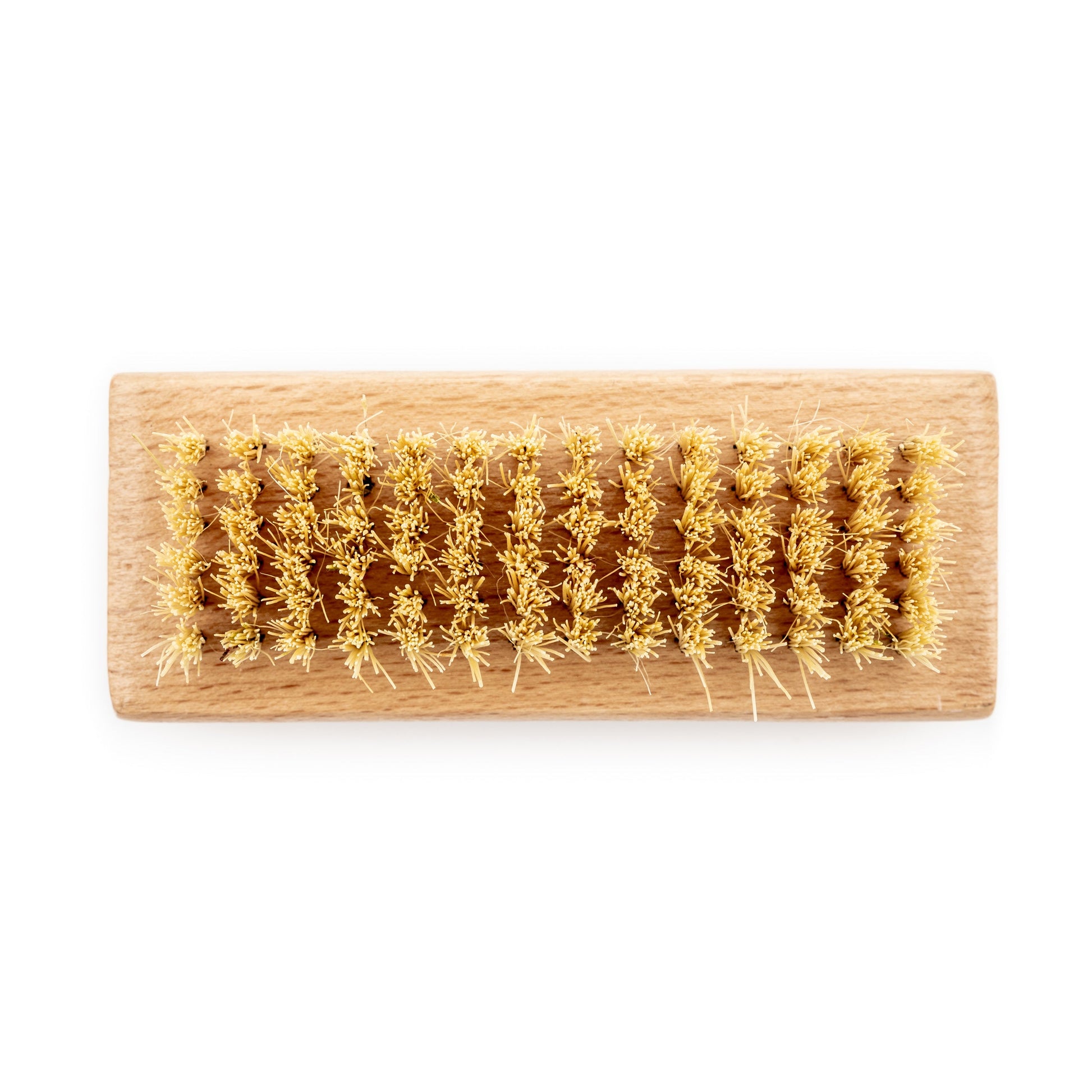 Wild And Stone biodegradable natural bristle nail brush with wooden handle for gentle nail cleaning and grooming.