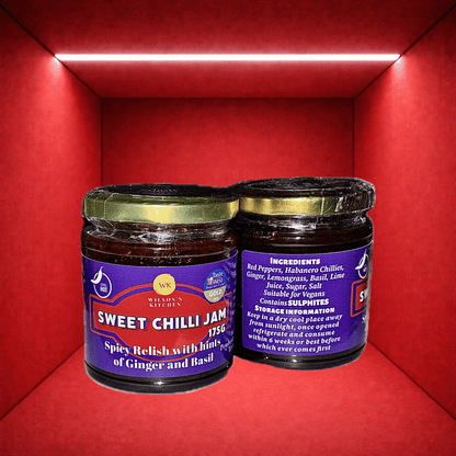 Award-winning Wilson’s Kitchen hot sweet chilli jam in a jar with visible red chili peppers and glossy, thick consistency.