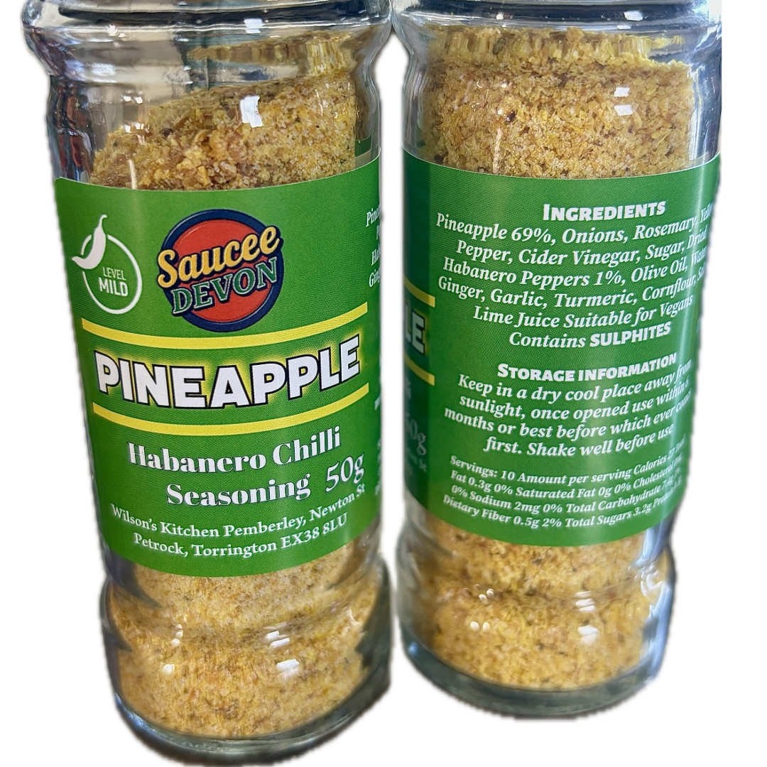 Wilson’s Kitchen Pineapple Habanero Chilli Seasoning in a jar, vibrant orange pineapple and red habanero peppers, artisan chilli sauce.