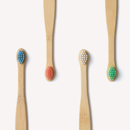 Wild and Stone baby bamboo toothbrush 4-pack with extra soft bristles, eco-friendly and gentle for infants' delicate gums.