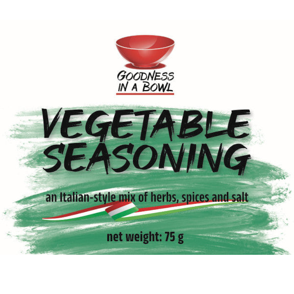 Close-up of GOODNESS IN A BOWL vegetable seasoning rub with colorful herbs and spices in a jar, ideal for enhancing vegetable dishes.