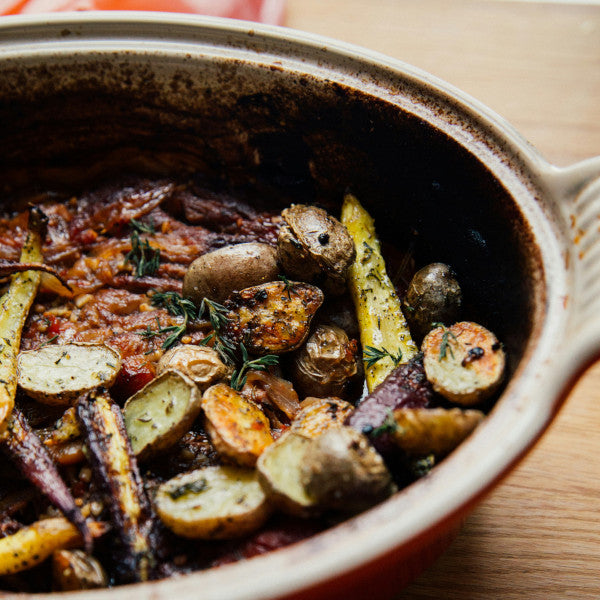 Goodness in a Bowl vegetable seasoning rub with fresh herbs and spices, perfect for enhancing vegetable dishes and healthy meals.