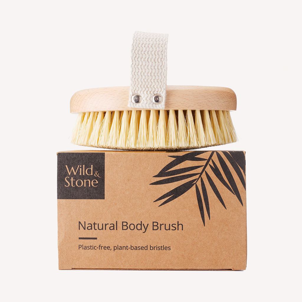 Wild and Stone natural bristle dry body brush with wooden handle for exfoliating and skin rejuvenation.