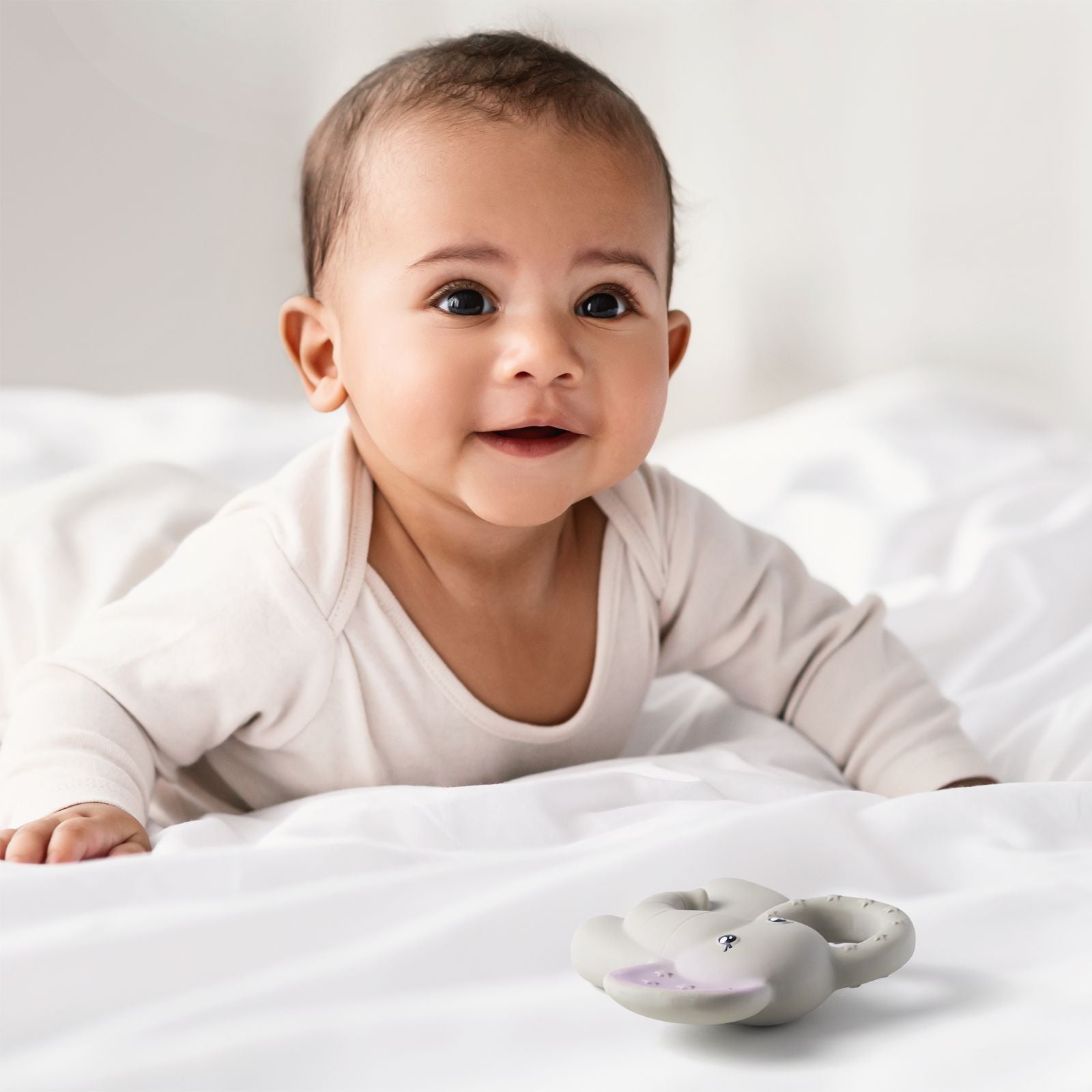 Natural rubber baby teether by Wild And Stone, showing a soft, textured natural rubber teether for soothing infants.