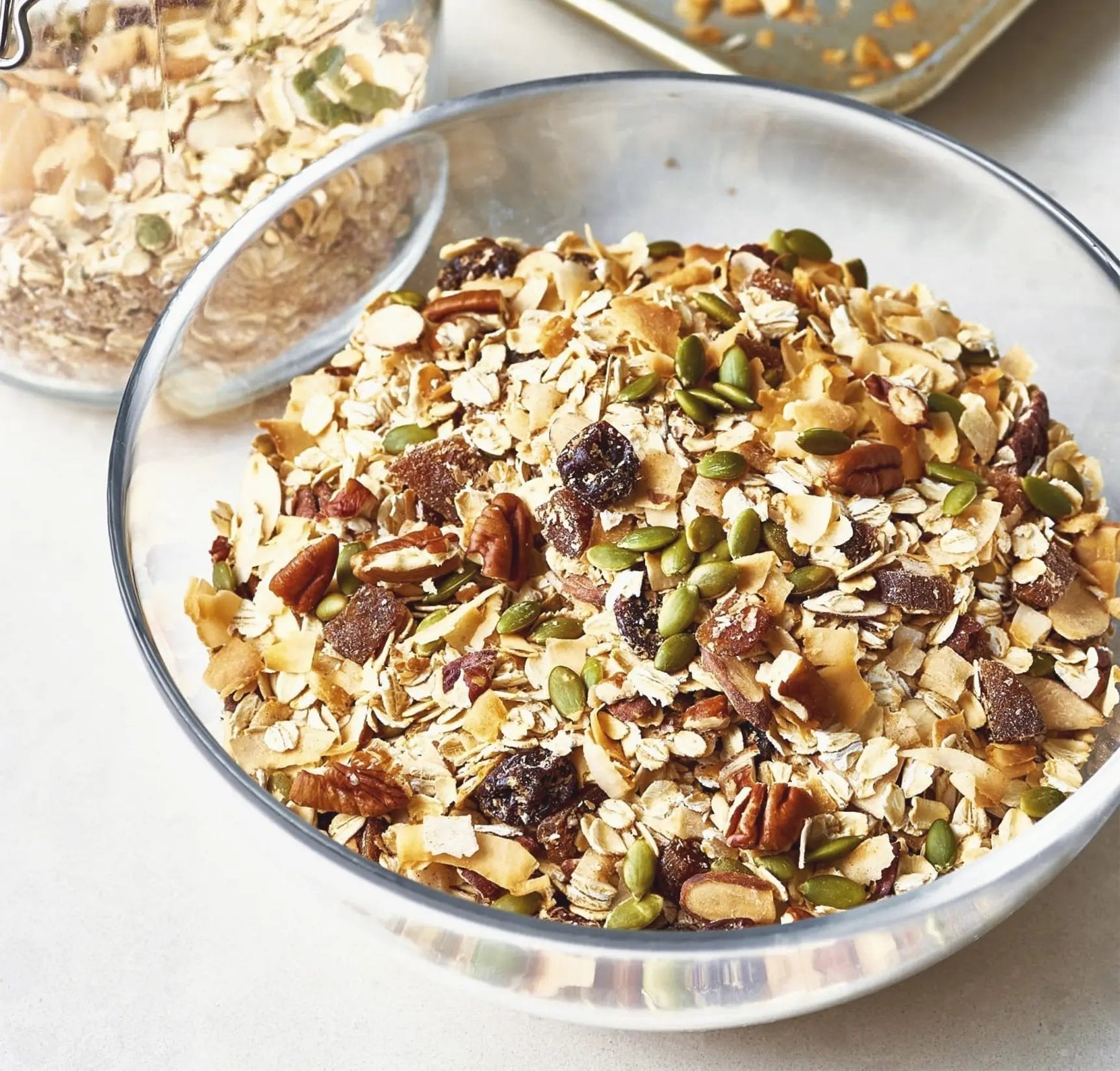 Whole Food Earth All Fruit Muesli cereal with dried fruits and grains, GMO-free, vegan, dairy-free, no added sugar in a bowl.