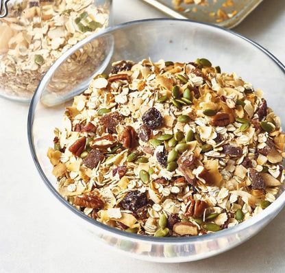 Whole Food Earth All Fruit Muesli cereal with dried fruits and grains, GMO-free, vegan, dairy-free, no added sugar in a bowl.
