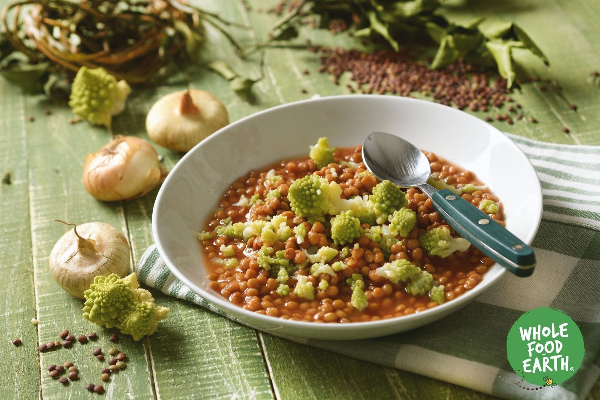 Brown lentils from Whole Food Earth, GMO-free, natural, vegan, dairy-free beans and pulses on a white background.