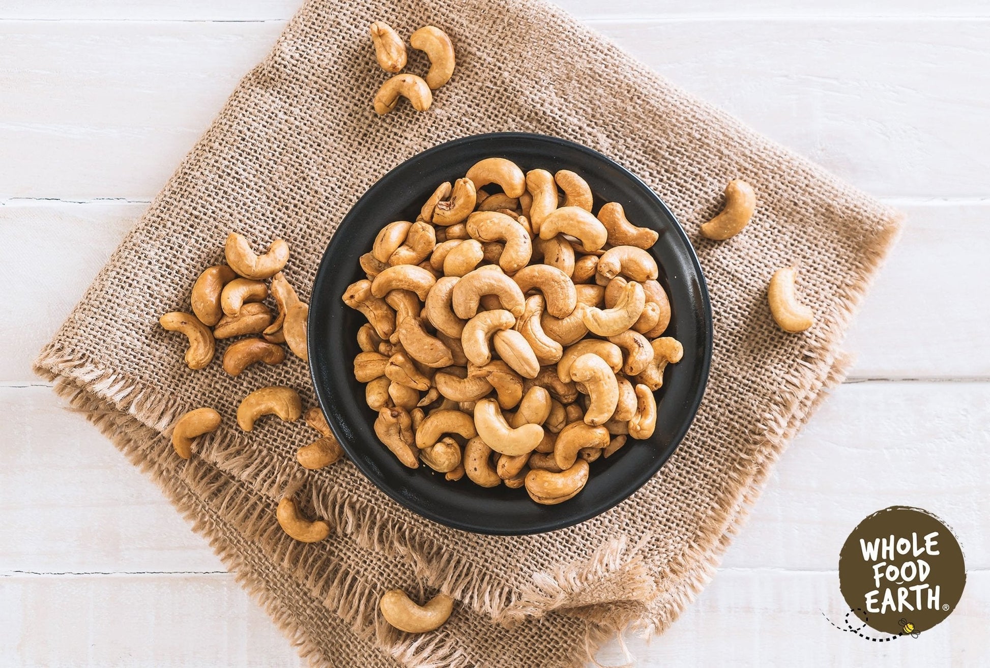 Roasted salted cashew nuts from Whole Food Earth, showing a close-up of golden, lightly salted nuts in a bowl.