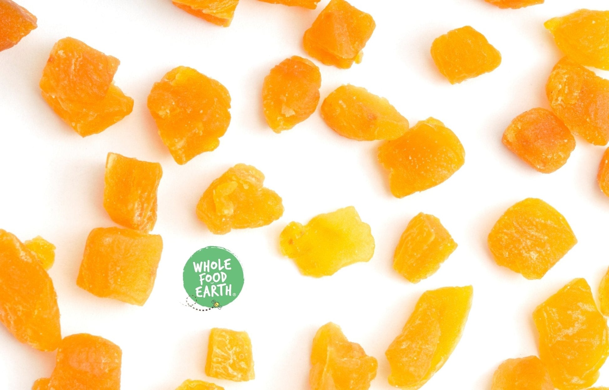 Dried chopped apricots from Whole Food Earth, GMO-free, vegan, dairy-free, with no added sugar, in a clear container.