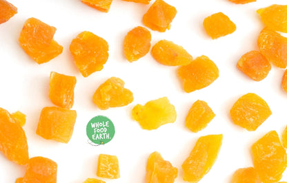 Dried chopped apricots from Whole Food Earth, GMO-free, vegan, dairy-free, with no added sugar, in a clear container.