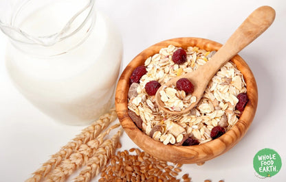 Whole Food Earth Cranberry Delight Muesli cereal with flakes, cranberries, and seeds in a natural, vegan, dairy-free mix.