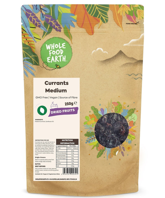 Medium dried currants from Whole Food Earth, GMO-free natural dried fruit, close-up of dark, wrinkled currants in a natural setting.