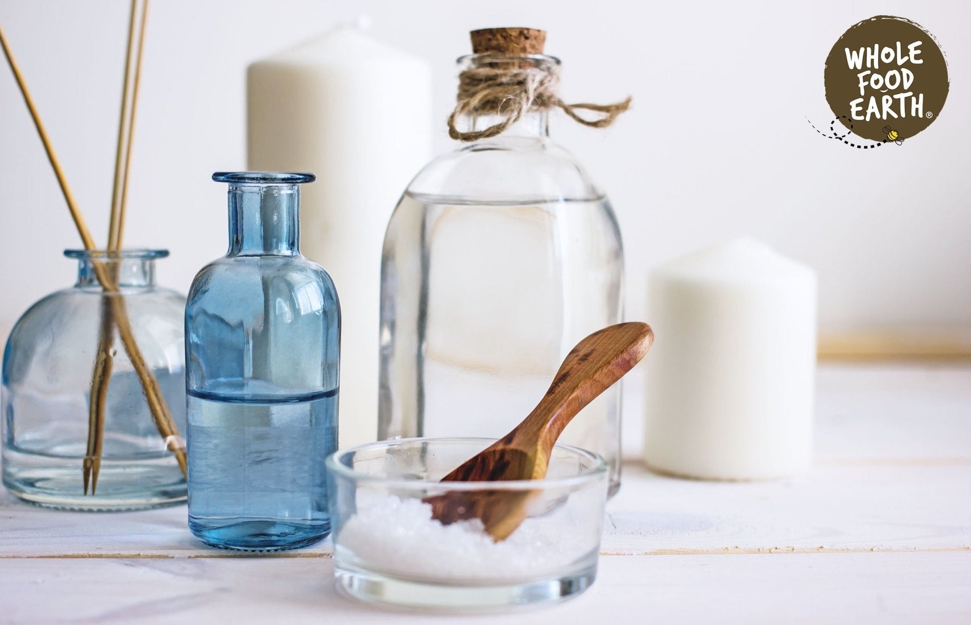 Additive-free Epsom Bath Salts from Whole Food Earth, showing white mineral salts in a clear container for relaxing bath soak.
