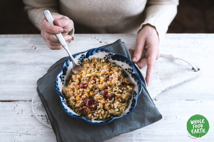 Whole Food Earth Freekeh cracked roasted wheat grain, GMO-free, vegan, dairy-free, in a clear bowl, highlighting natural whole grains.