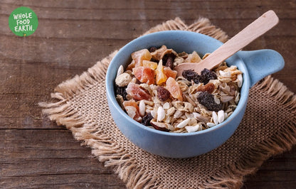 Organic gluten-free muesli cereal by Whole Food Earth with flakes, dried fruit, and nuts, vegan and dairy-free.