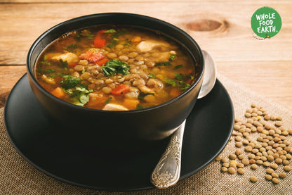 Whole Food Earth green lentils, GMO-free, natural vegan beans and pulses, fresh and healthy in a clear container.