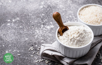 Whole Food Earth ground rice in a bowl, showcasing its fine texture, perfect for gluten-free cooking and vegan recipes.