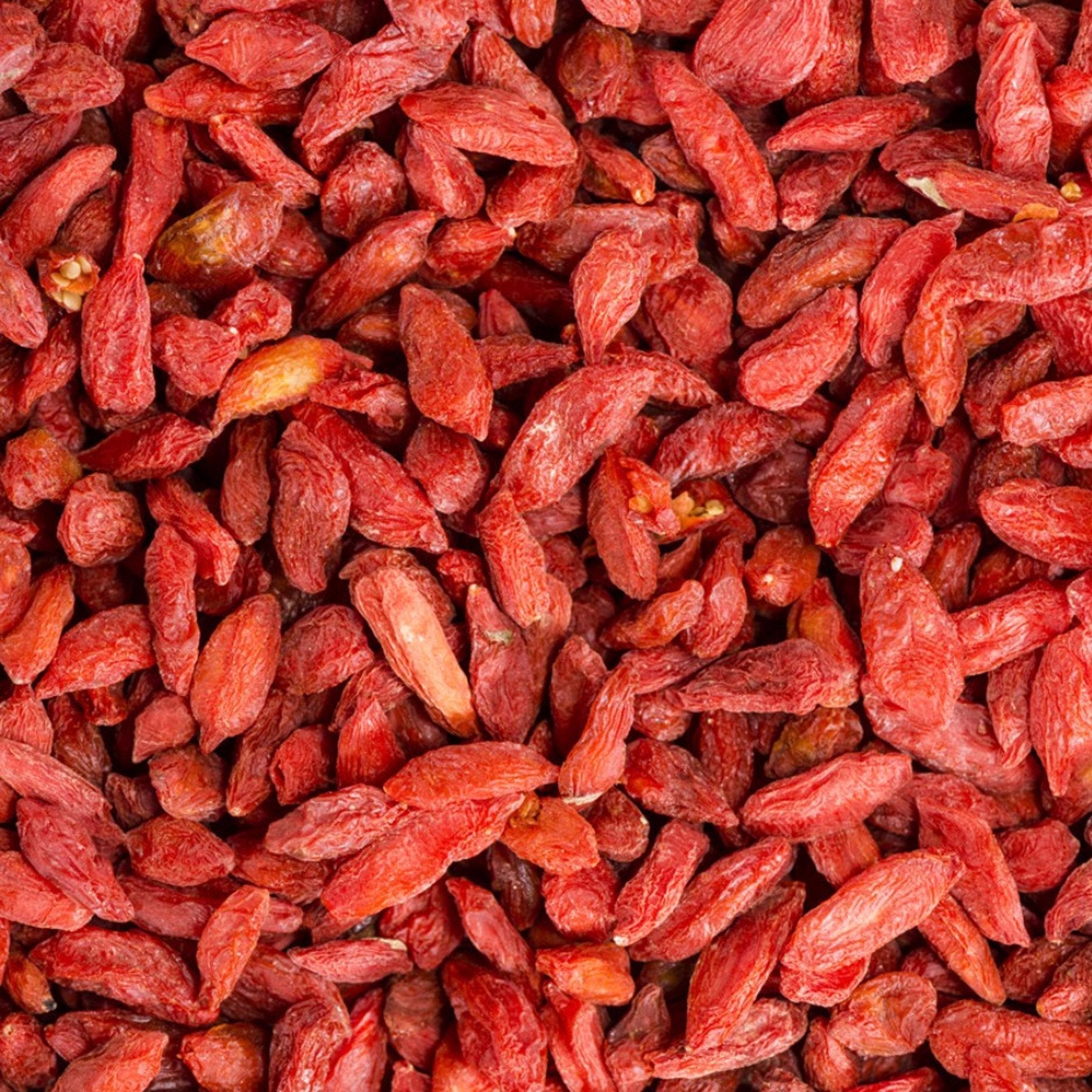 Dried Goji Berries from Whole Food Earth, raw and sun-dried, GMO-free superfood with bright red color and plump appearance.