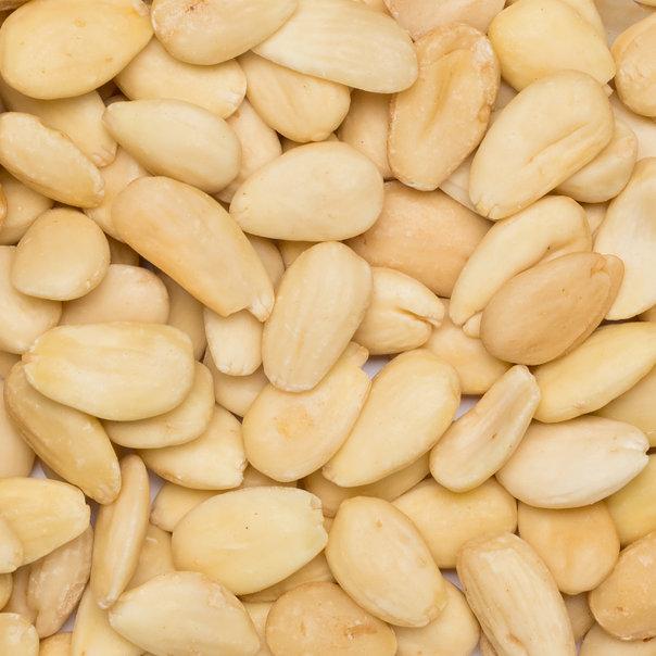 Organic blanched almonds from Whole Food Earth, raw GMO-free nuts and seeds with smooth, pale almond kernels in a natural setting.