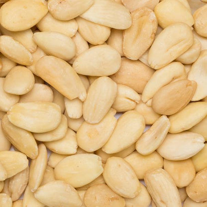 Organic blanched almonds from Whole Food Earth, raw GMO-free nuts and seeds with smooth, pale almond kernels in a natural setting.