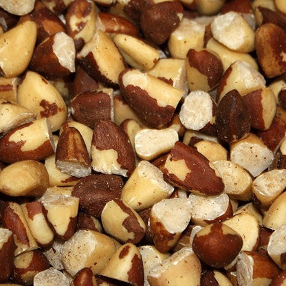 Raw organic broken Brazil nuts from Whole Food Earth, showing their rough, natural texture and rich, nutty appearance.