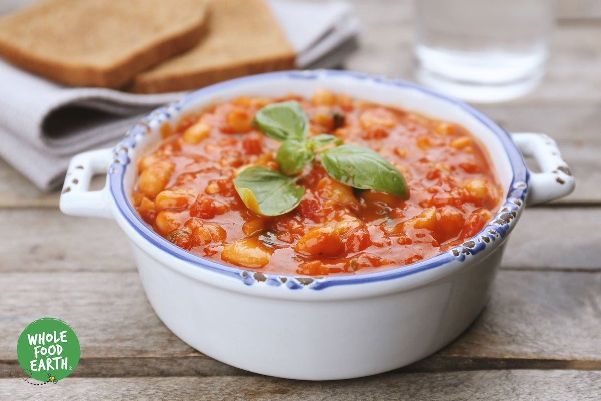 Organic Butter Beans from Whole Food Earth, GMO-free beans and pulses in a clear bowl, ready for cooking or serving.