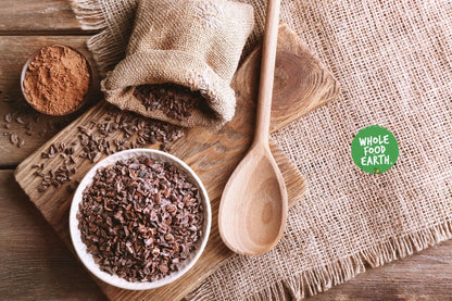 Organic Cacao Nibs from Whole Food Earth, raw vegan, GMO-free, and sourced from Peru, shown in a close-up image.