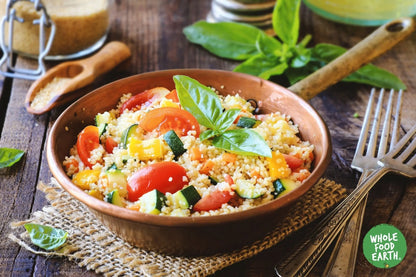 Raw organic spelt couscous from Whole Food Earth, GMO-free, vegan, and additive-free, shown in a close-up image.