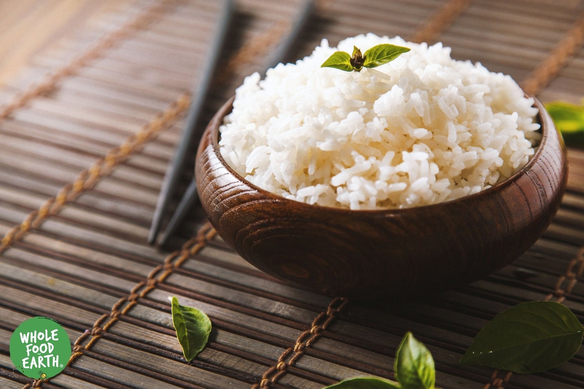 Organic Jasmine White Rice from Whole Food Earth, raw, GMO-free, vegan, in a clear bag showing white rice grains.