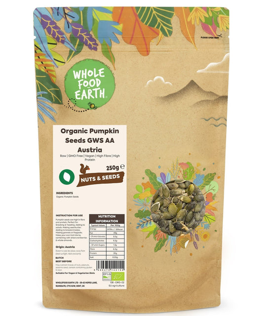 Organic Pumpkin Seeds GWS AA from Whole Food Earth, raw and unsalted, in a clear bowl on a wooden surface.