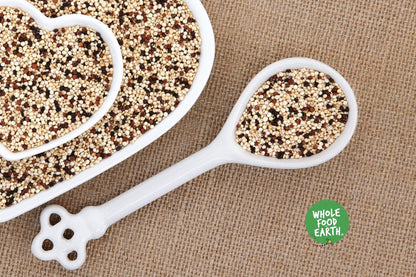 Tri-color organic quinoa grains from Whole Food Earth, raw, GMO-free, vegan-friendly, shown in a close-up image.