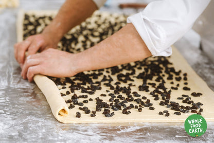 Organic raisins from Whole Food Earth, dried fruit with plump, golden and dark raisins in a resealable bag.
