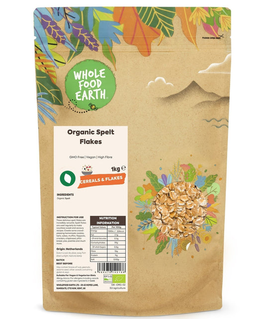 Wholegrain Organic Spelt Flakes from ArtisanBox, GMO-free cereal in a clear bowl on a wooden surface.