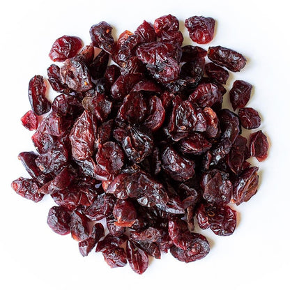 Organic sweetened dried cranberries from Whole Food Earth, GMO-free dried fruits with vibrant red color and textured surface.