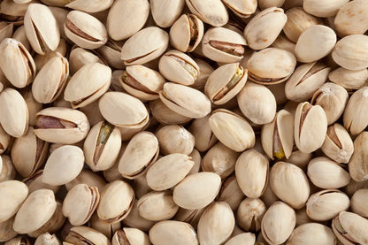 Roasted and salted pistachios from Whole Food Earth, GMO-free nuts and seeds in a close-up image.