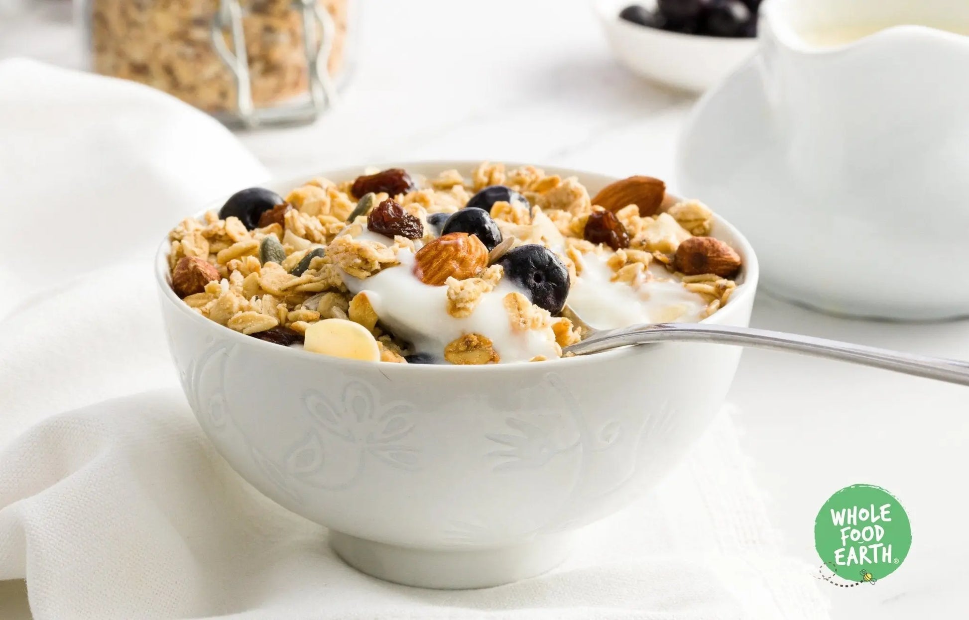 Whole Food Earth Premium Breakfast Muesli cereal with flakes, dried fruit, nuts, and seeds in a natural, wholesome mix.