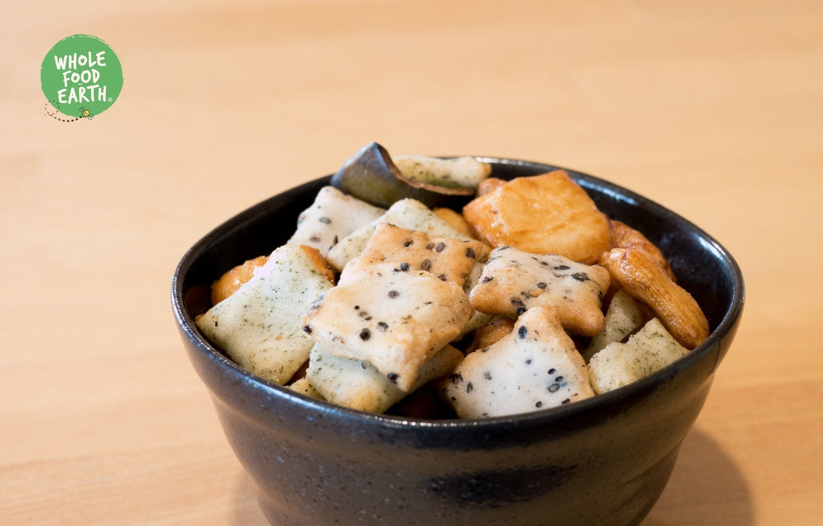 Whole Food Earth rice cracker mix featuring crispy rice and peanut crackers, vegan, dairy-free, and GMO-free snack assortment.