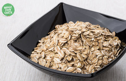 Whole Food Earth rye flakes, GMO-free, vegan, dairy-free, no added sugar, specialty cereal in a clear bowl.