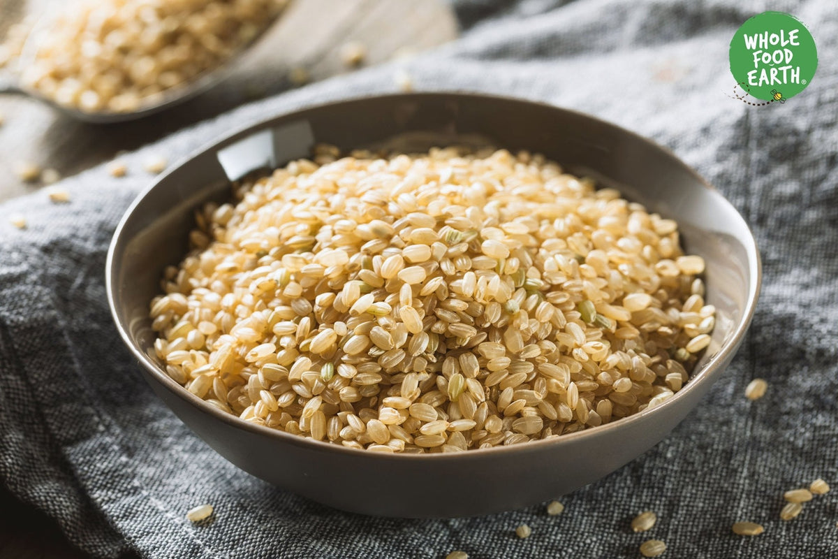 Whole Food Earth short grain brown rice in a bag, GMO-free, natural, vegan, dairy-free, no added sugar, for healthy cooking.