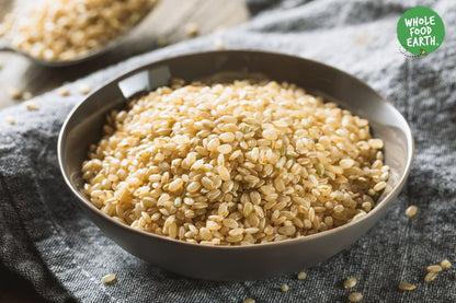 Whole Food Earth short grain brown rice in a bag, GMO-free, natural, vegan, dairy-free, no added sugar, for healthy cooking.